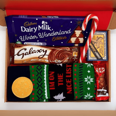 Men’s Christmas Letterbox Gift from The Happiness Box - festive chocolates, socks, and puzzle game in red tissue-lined box